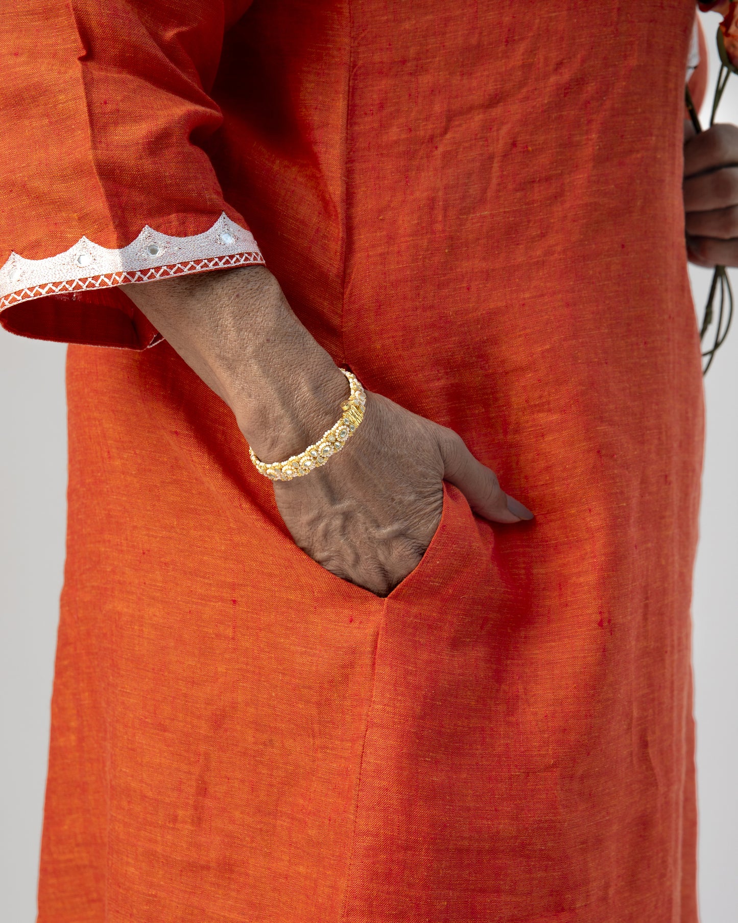 Pure Linen A-Line Orange Kurta With White Hand Embroidery and Mirror Highlight on Neck, Sleeves and Back